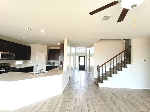 a view of a living room and a wooden floor
