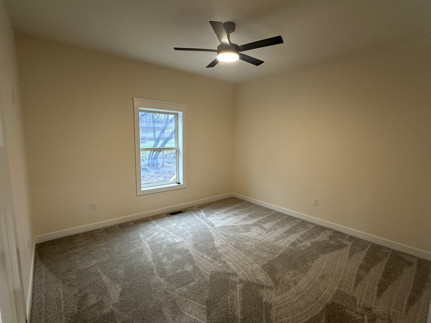 309 Creekside Drive Byron, IL 61010 - Photo 8 of 11 a view of empty room with ceiling fan