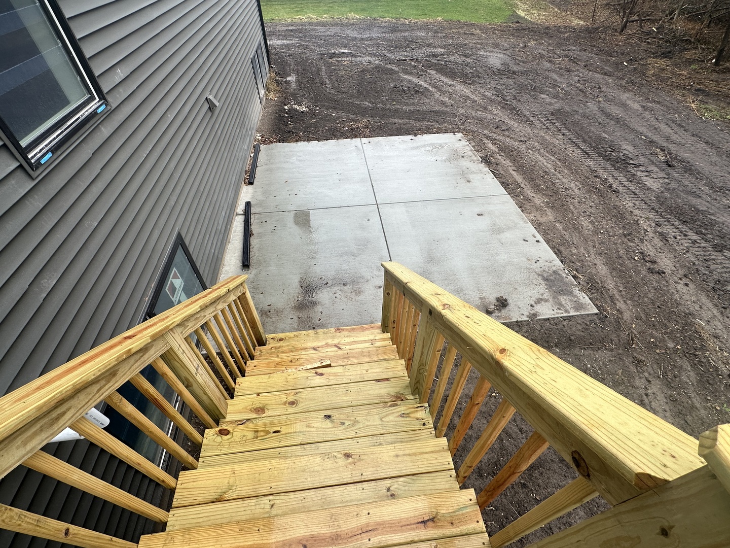 309 Creekside Drive Byron, IL 61010 - Photo 10 of 11 a view of wooden balcony with two chairs