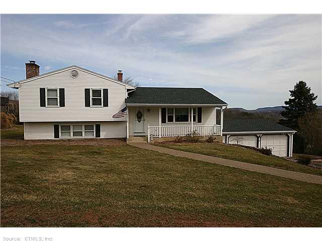 513 West Main Street Meriden, CT 06451 - Photo 1 of 1 a front view of a house with a garden
