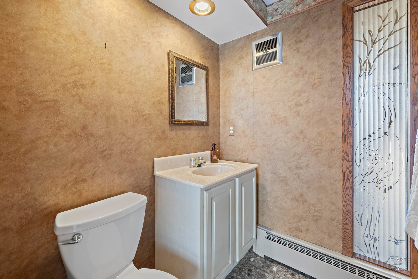 7814 North Pillow Hill Road Spring Grove, IL 60081 - Photo 20 of 62 a bathroom with a toilet sink and mirror