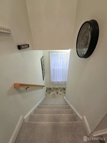 a kitchen with stainless steel appliances granite countertop sink refrigerator and cabinets