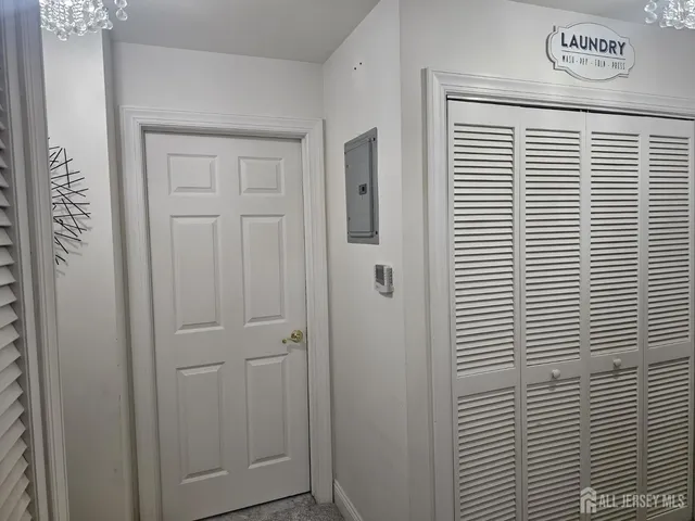 a bathroom with a sink a toilet a mirror and shower