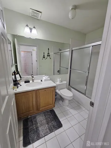 a view of a hallway with a bathroom