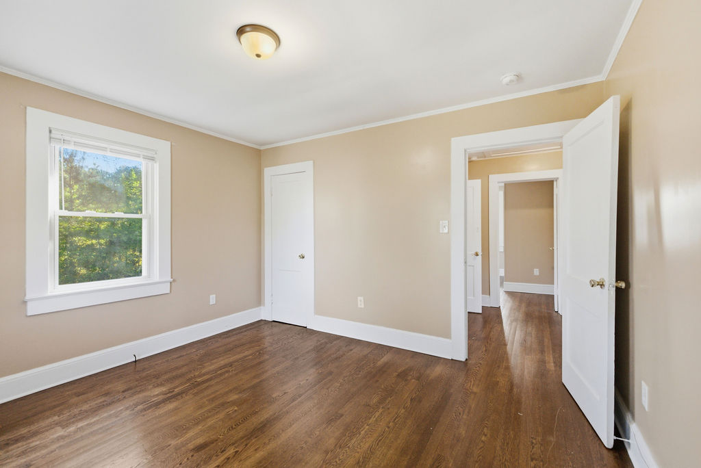 7604 Highway 252 Honea Path, SC 29654 - Photo 20 of 33 This inviting bedroom features rich hardwood flooring and abundant natural light through its large window.