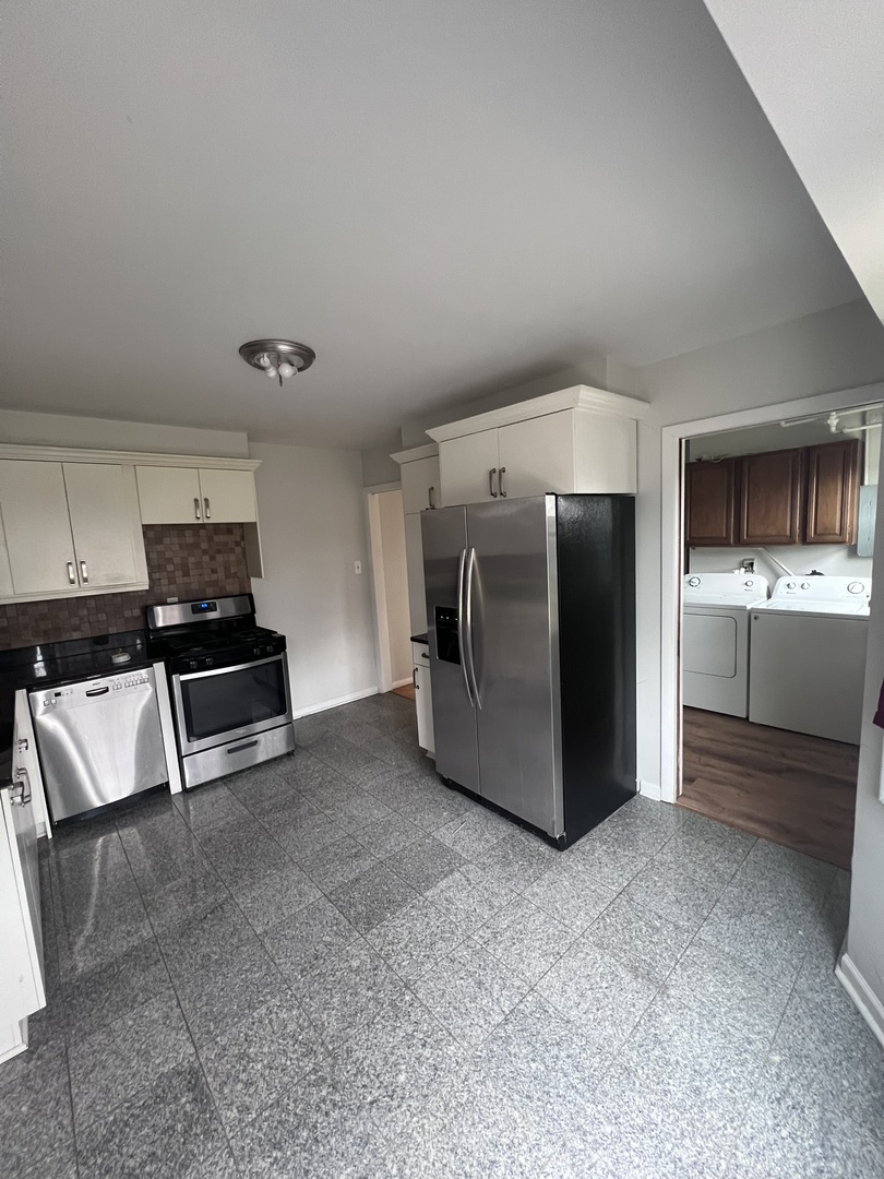 Undisclosed Address Chicago, IL 60656 - Photo 5 of 11 a kitchen with stainless steel appliances a refrigerator and a stove