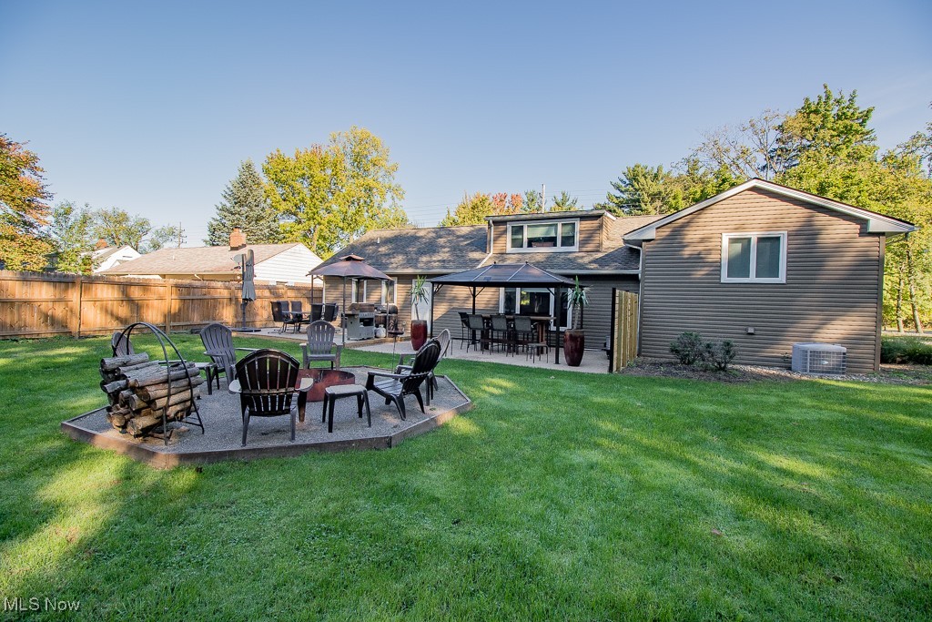 27230 Highland Road Cleveland, OH 44143 - Photo 13 of 41 New firepit 2023. The large arbor stays with the sale of the home along with the high-top table and chairs
