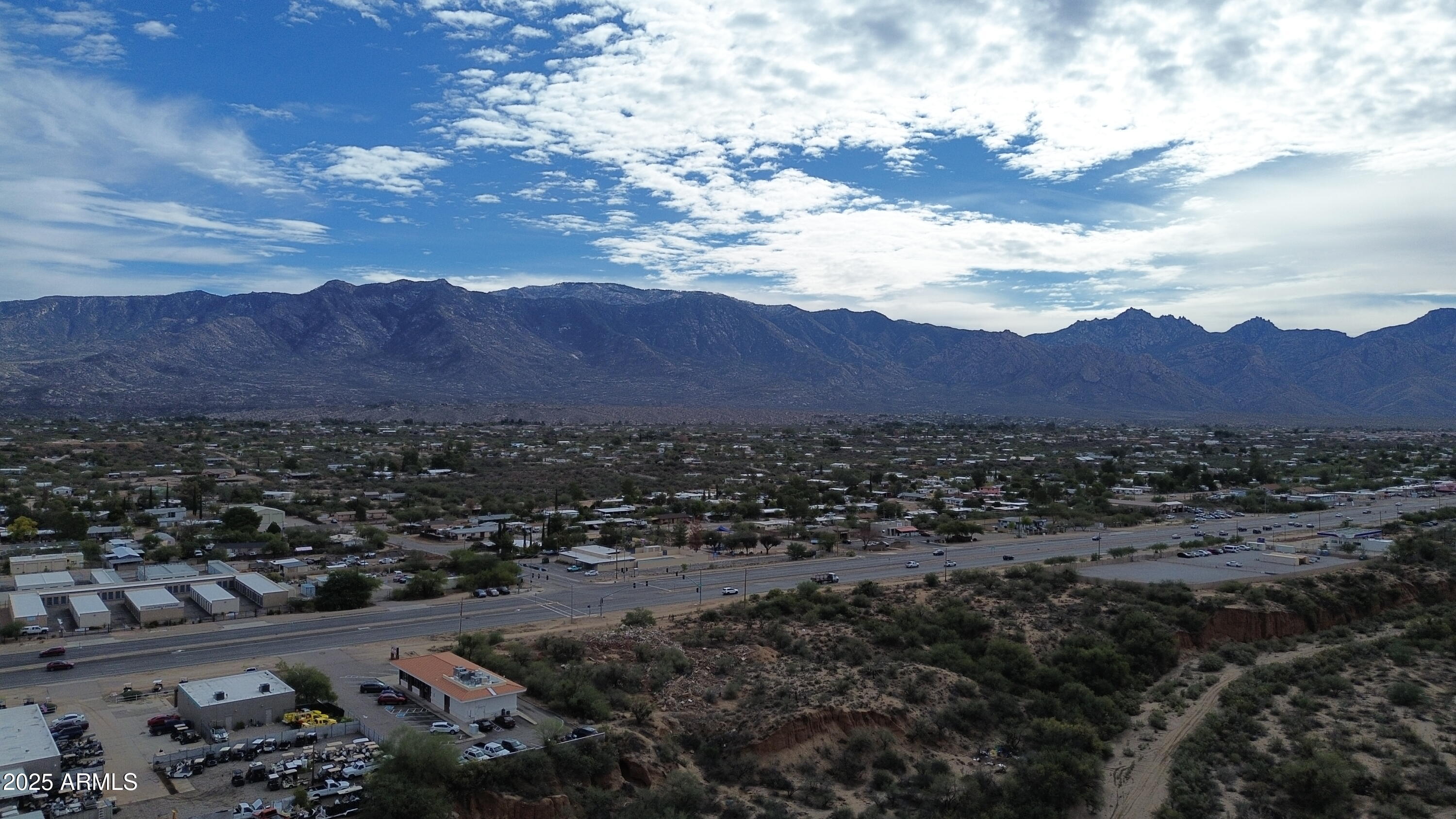 16633 North Oracle Road Tucson, AZ 85739 - Photo 16 of 40 a view of a city with lots of residential buildings and mountain view in back