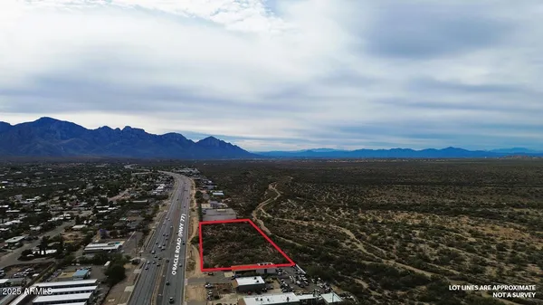 an aerial view of residential building and ocean view