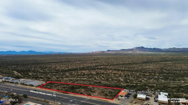 an aerial view of residential house and car parked
