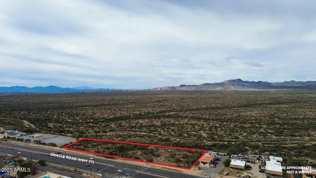 an aerial view of residential house and car parked