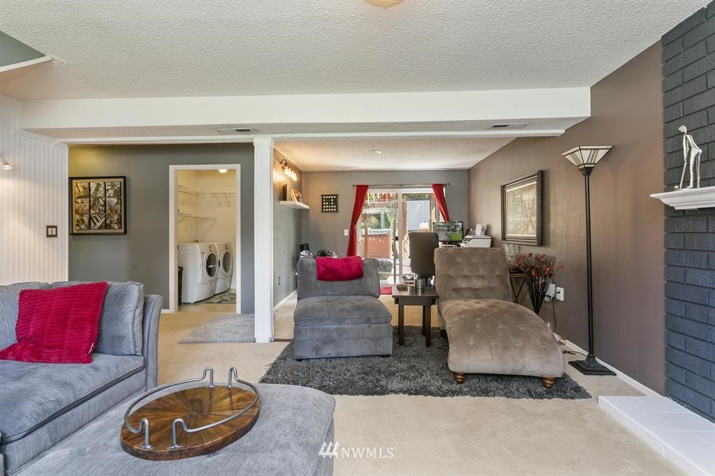 17405 Brook Boulevard Bothell, WA 98012 - Photo 15 of 25 a living room with furniture and a wooden floor