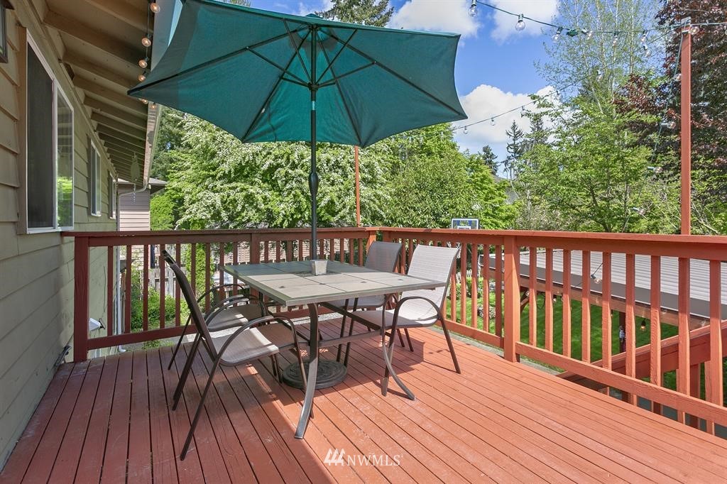 17405 Brook Boulevard Bothell, WA 98012 - Photo 19 of 25 a view of balcony with furniture and wooden deck