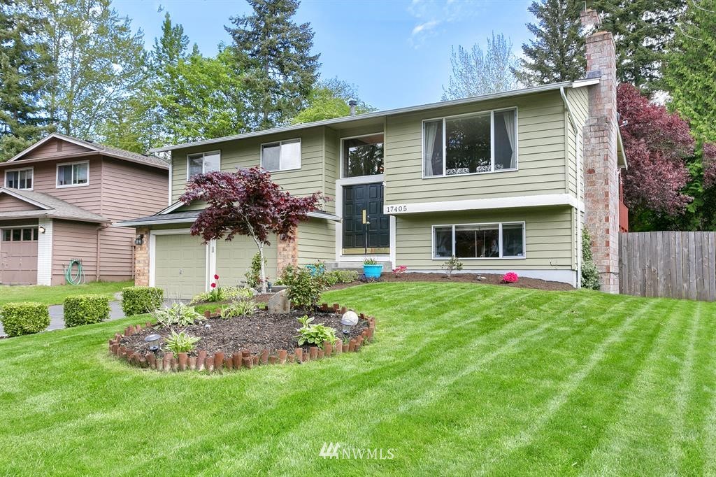 17405 Brook Boulevard Bothell, WA 98012 - Photo 24 of 25 a front view of a house with a yard and porch