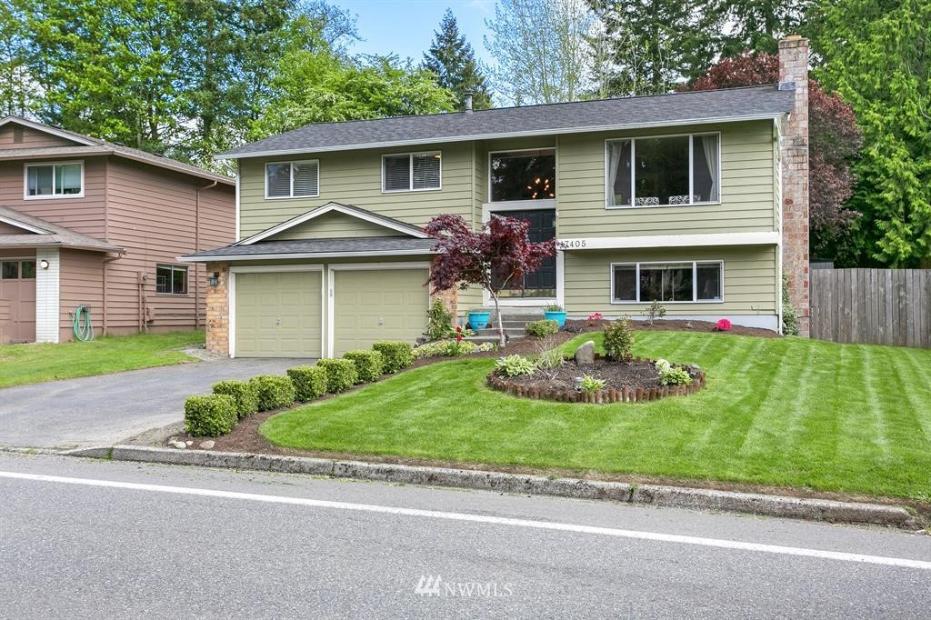 17405 Brook Boulevard Bothell, WA 98012 - Photo 25 of 25 a front view of house with yard and green space