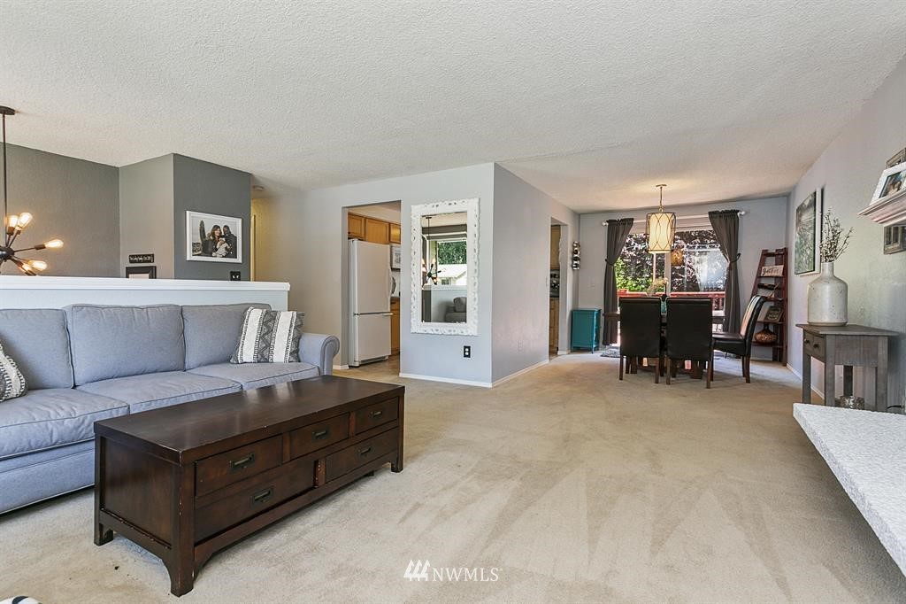 17405 Brook Boulevard Bothell, WA 98012 - Photo 4 of 25 a living room with furniture and dining table