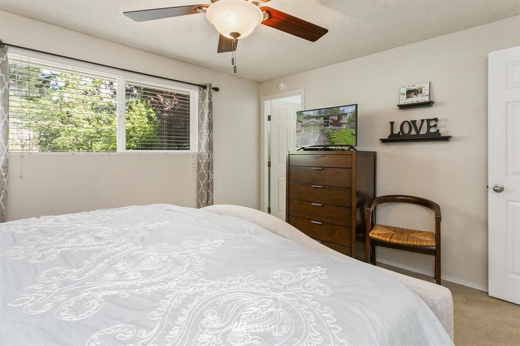 17405 Brook Boulevard Bothell, WA 98012 - Photo 9 of 25 a bedroom with a bed and a dresser