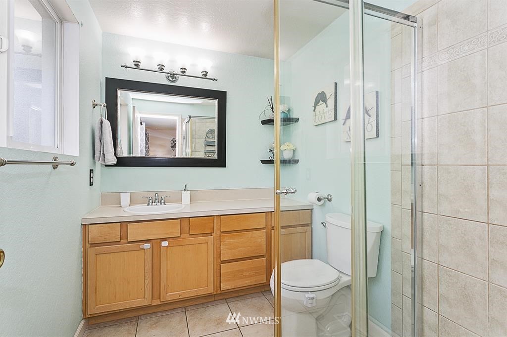 17405 Brook Boulevard Bothell, WA 98012 - Photo 10 of 25 a bathroom with a toilet sink and mirror