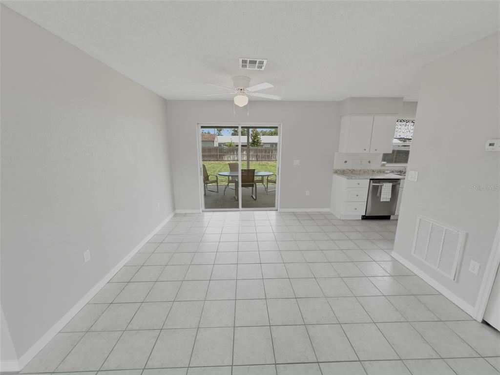 2202 Godfrey Avenue Spring Hill, FL 34609 - Photo 11 of 36 a view of an empty room with a window