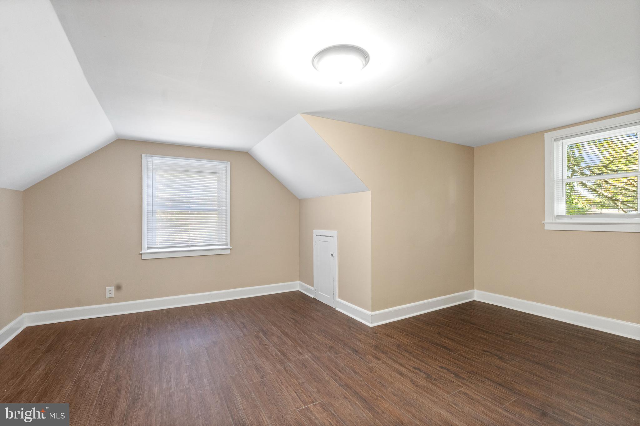 188 Cook Avenue Salem, NJ 08079 - Photo 15 of 25 a view of an empty room with wooden floor and a window