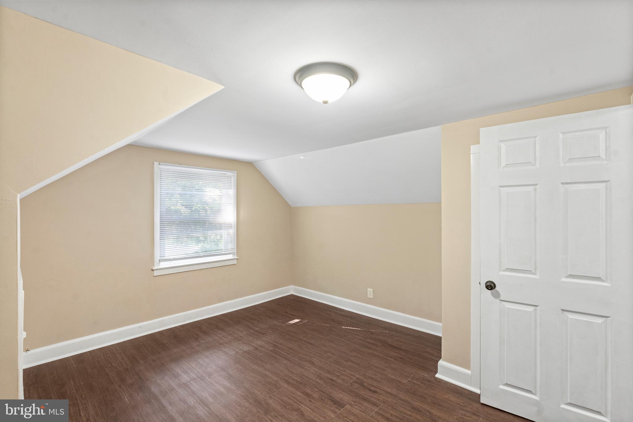 188 Cook Avenue Salem, NJ 08079 - Photo 21 of 25 an empty room with wooden floor and windows
