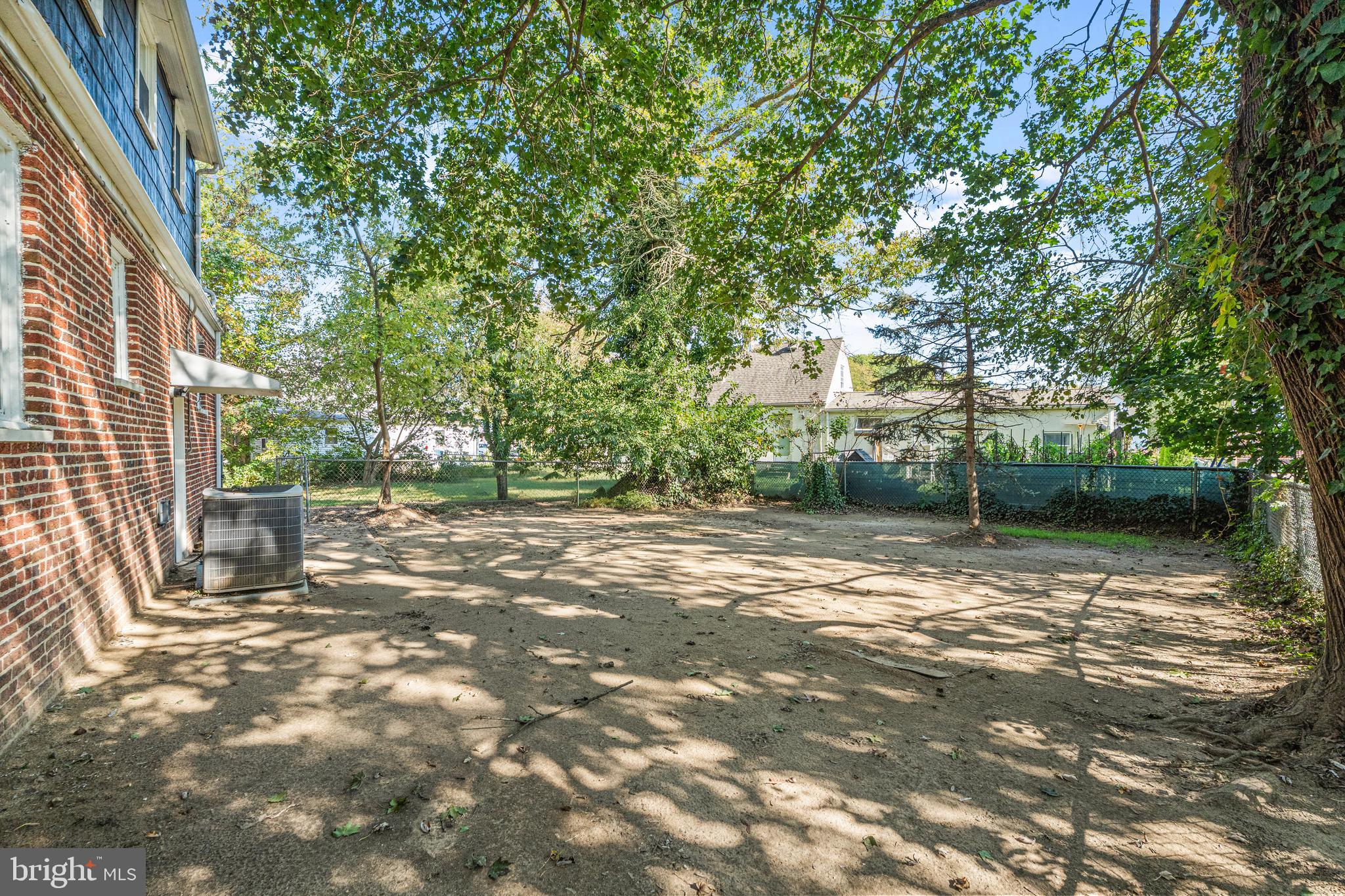 188 Cook Avenue Salem, NJ 08079 - Photo 24 of 25 a backyard of a house with large trees and plants