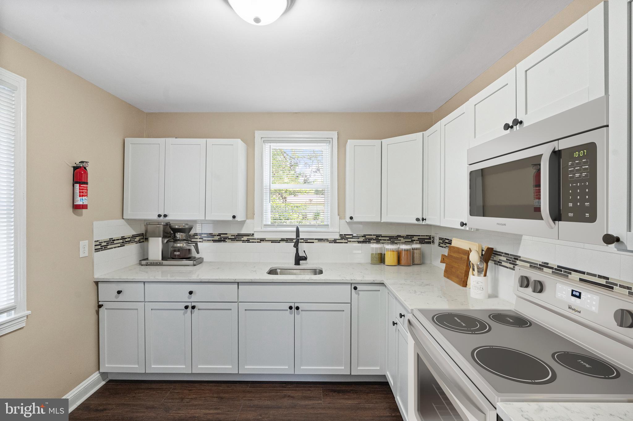 188 Cook Avenue Salem, NJ 08079 - Photo 7 of 25 a kitchen with a sink stove and cabinets