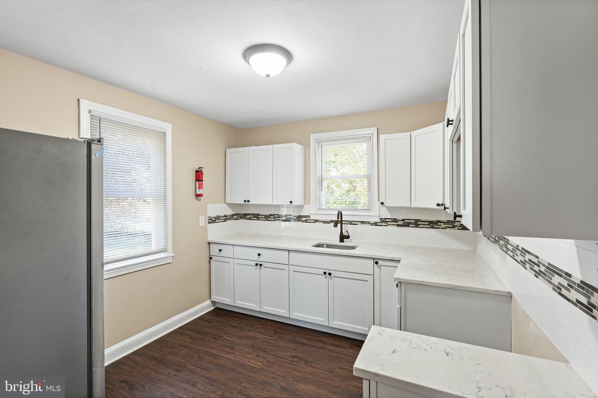 188 Cook Avenue Salem, NJ 08079 - Photo 8 of 25 a bathroom with a sink double vanity granite tub and a window