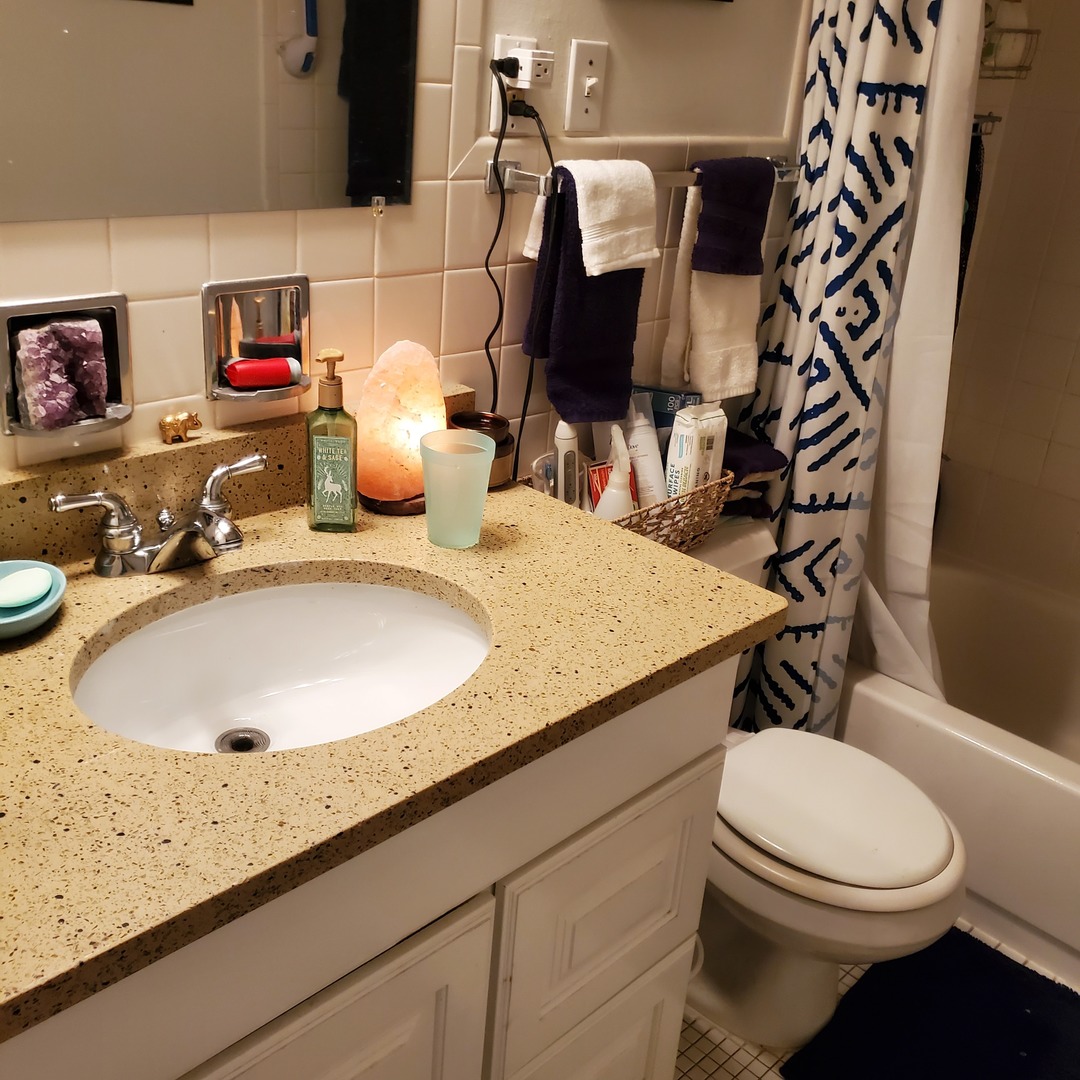 910 Washington Street, Unit 1A Evanston, IL 60202 - Photo 11 of 14 a bathroom with a granite countertop sink mirror vanity and toilet