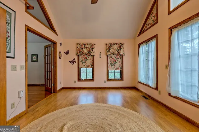 a view of an entryway with wooden floor