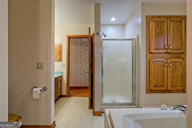 a view of an entryway with wooden floor and door