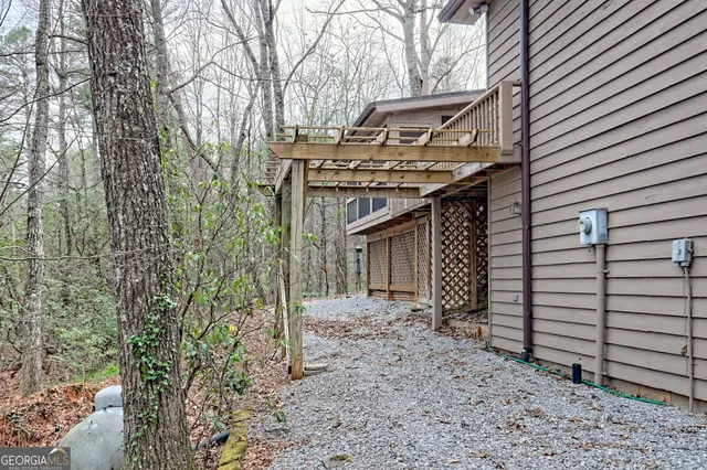 a view of a two chairs in the balcony