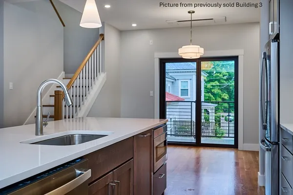 a kitchen with a table and chairs