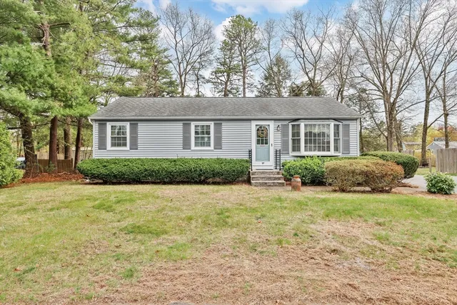 front view of a house with a yard