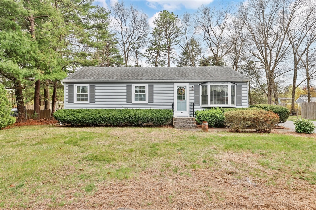 front view of a house with a yard