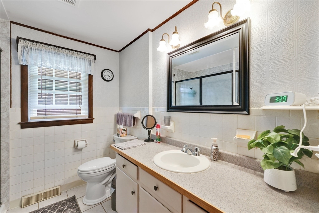 37 Kenneth Road Easthampton, MA 01027 - Photo 17 of 35 a bathroom with a toilet a sink and mirror