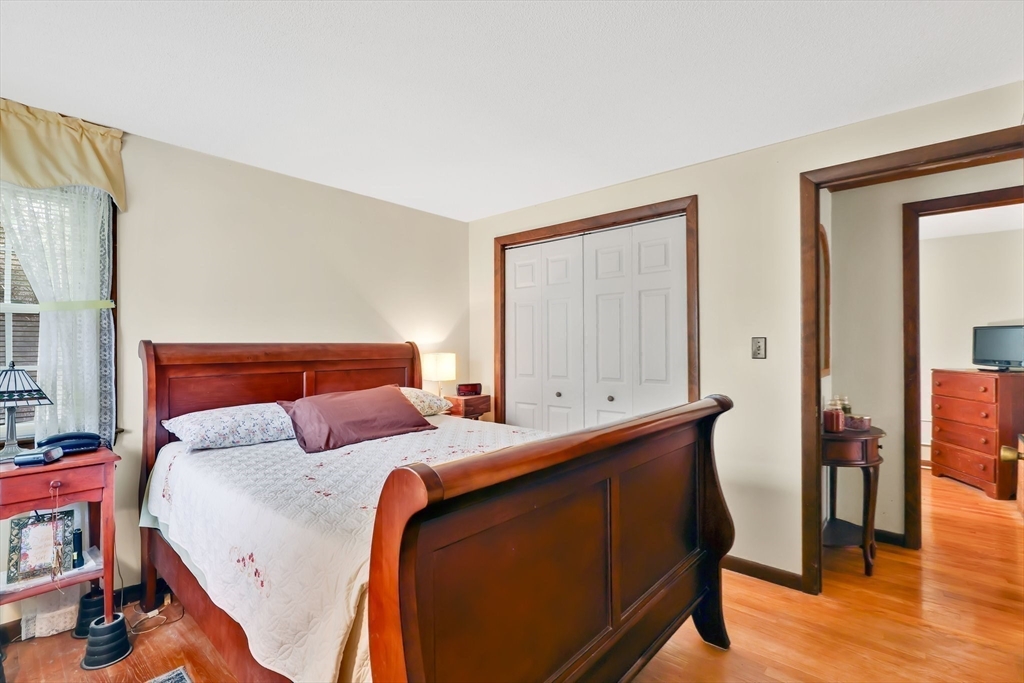 37 Kenneth Road Easthampton, MA 01027 - Photo 22 of 35 a bedroom with a bed and wooden floor