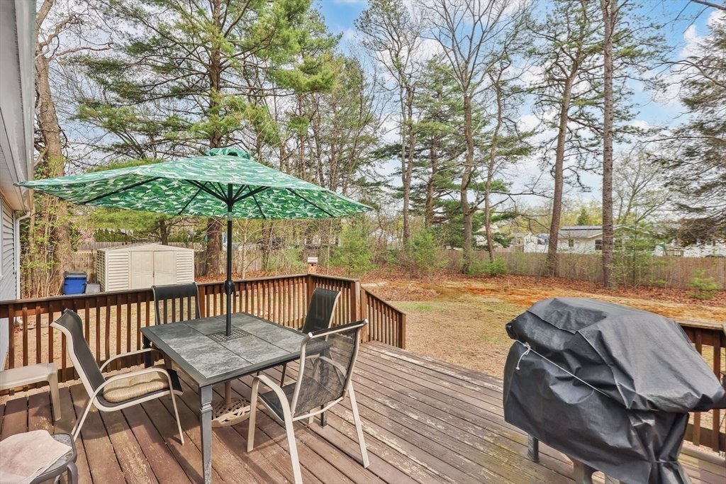 37 Kenneth Road Easthampton, MA 01027 - Photo 28 of 35 a patio with wooden floor table and chairs