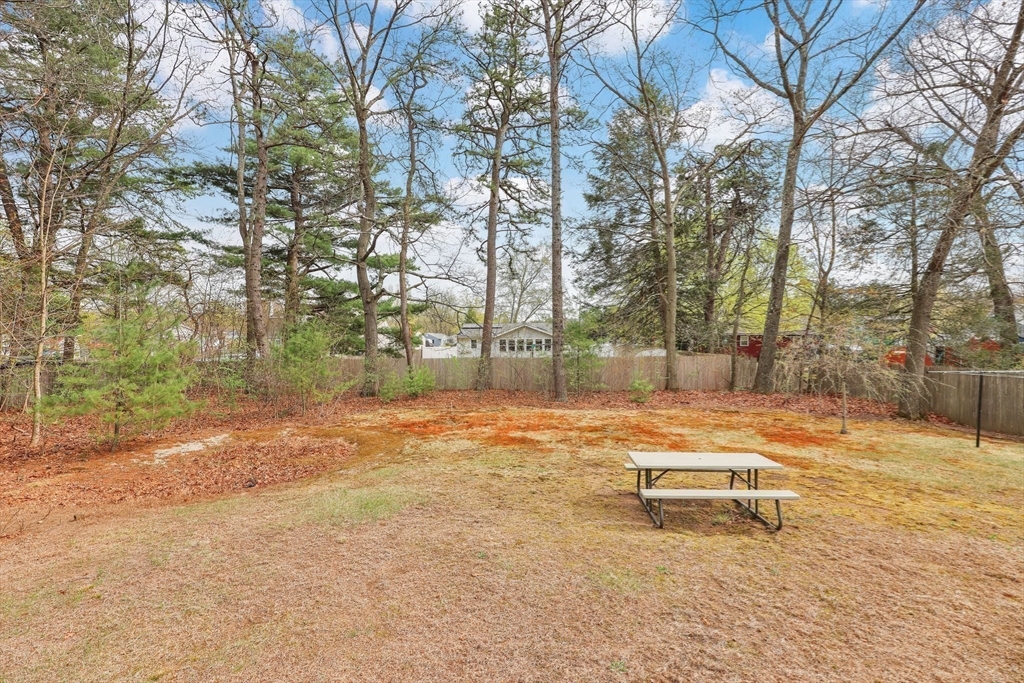 37 Kenneth Road Easthampton, MA 01027 - Photo 33 of 35 a backyard of a house with table and chairs