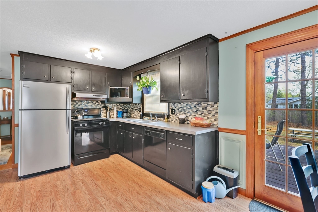 37 Kenneth Road Easthampton, MA 01027 - Photo 5 of 35 a kitchen with stainless steel appliances granite countertop a refrigerator a sink dishwasher a stove with wooden floor