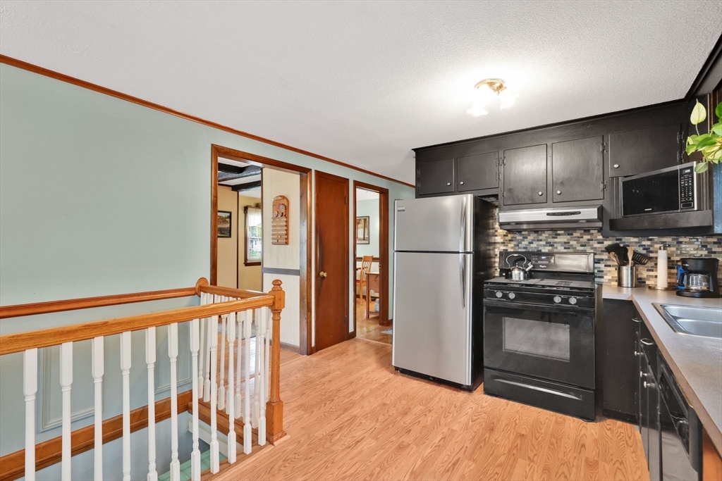 37 Kenneth Road Easthampton, MA 01027 - Photo 6 of 35 a kitchen with stainless steel appliances granite countertop a refrigerator a stove and a sink