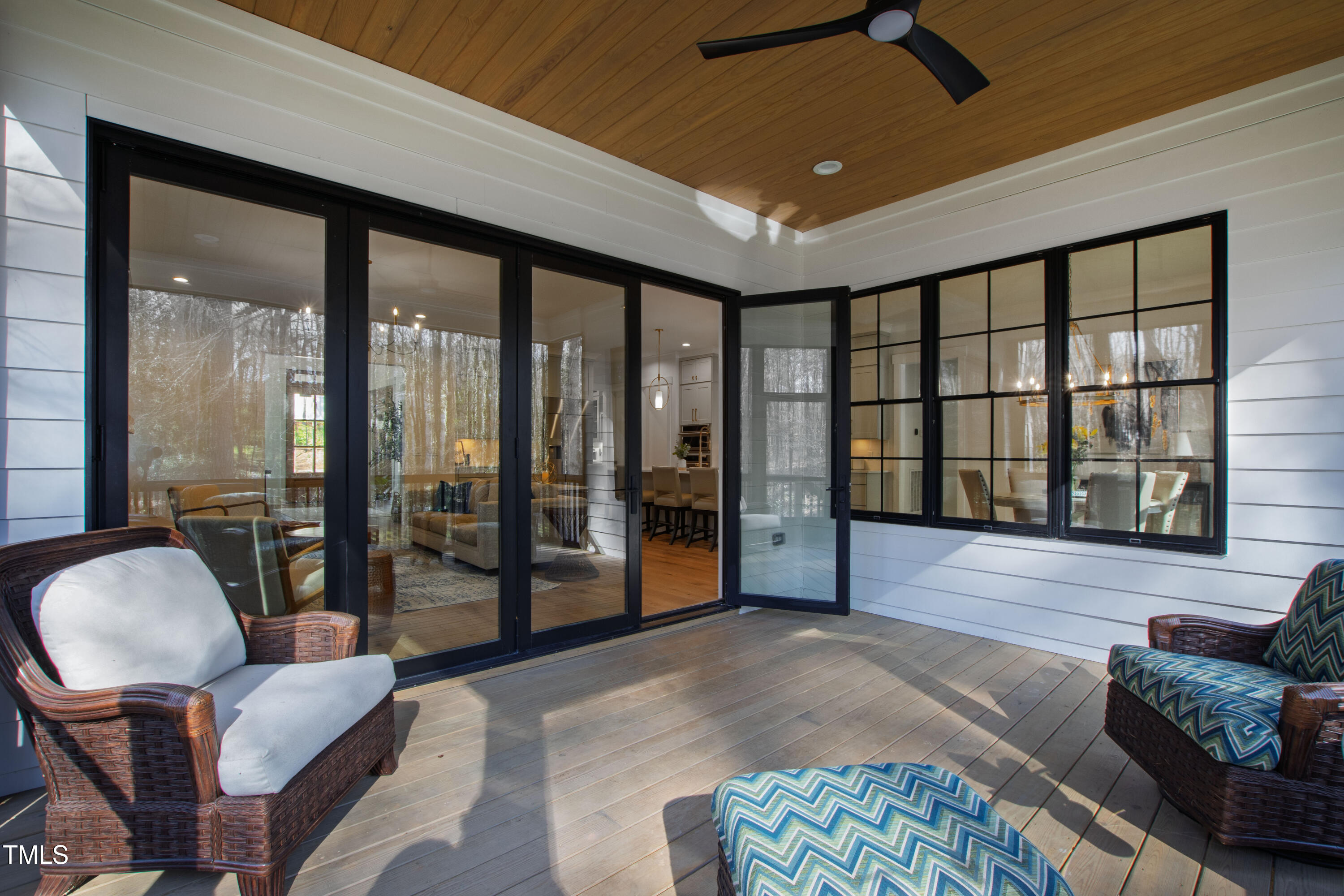 6816 Rainwater Road Raleigh, NC 27615 - Photo 51 of 66 a living room with furniture and a floor to ceiling window