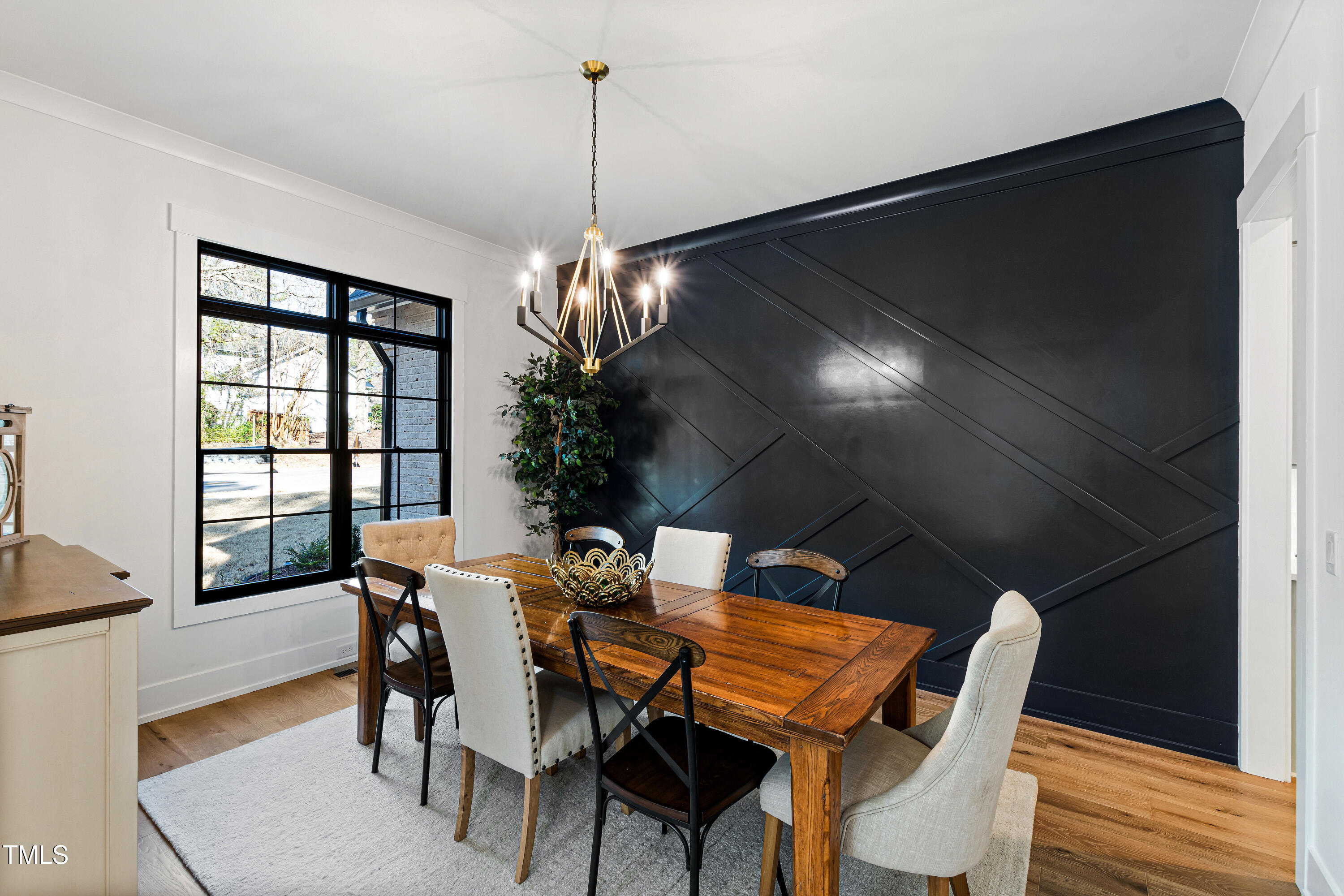 6816 Rainwater Road Raleigh, NC 27615 - Photo 8 of 66 a view of a dining room with furniture window and wooden floor