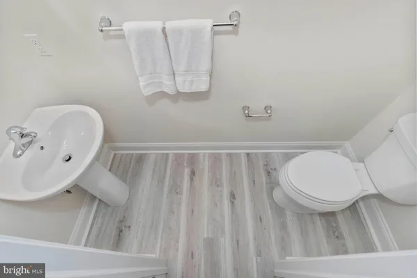 a bathroom with a toilet and a sink