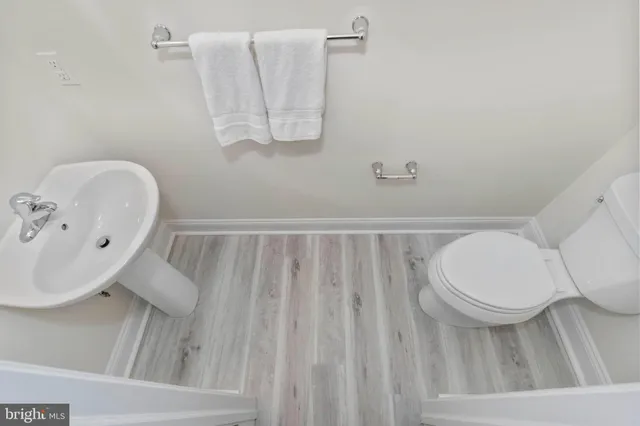 a bathroom with a toilet and a sink