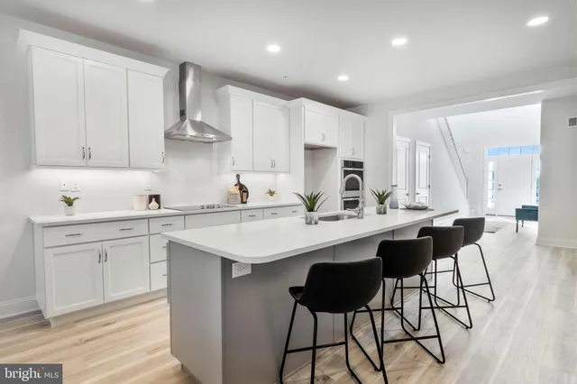 a kitchen with a sink cabinets and window