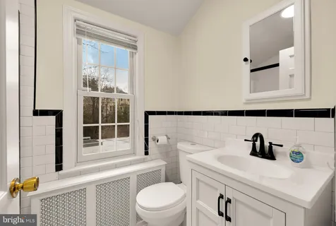 a view of a balcony with wooden floor and fence