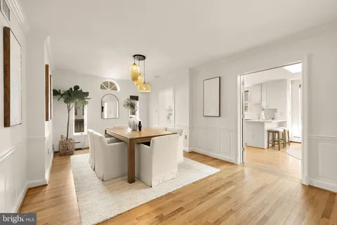 a kitchen with granite countertop white cabinets and sink