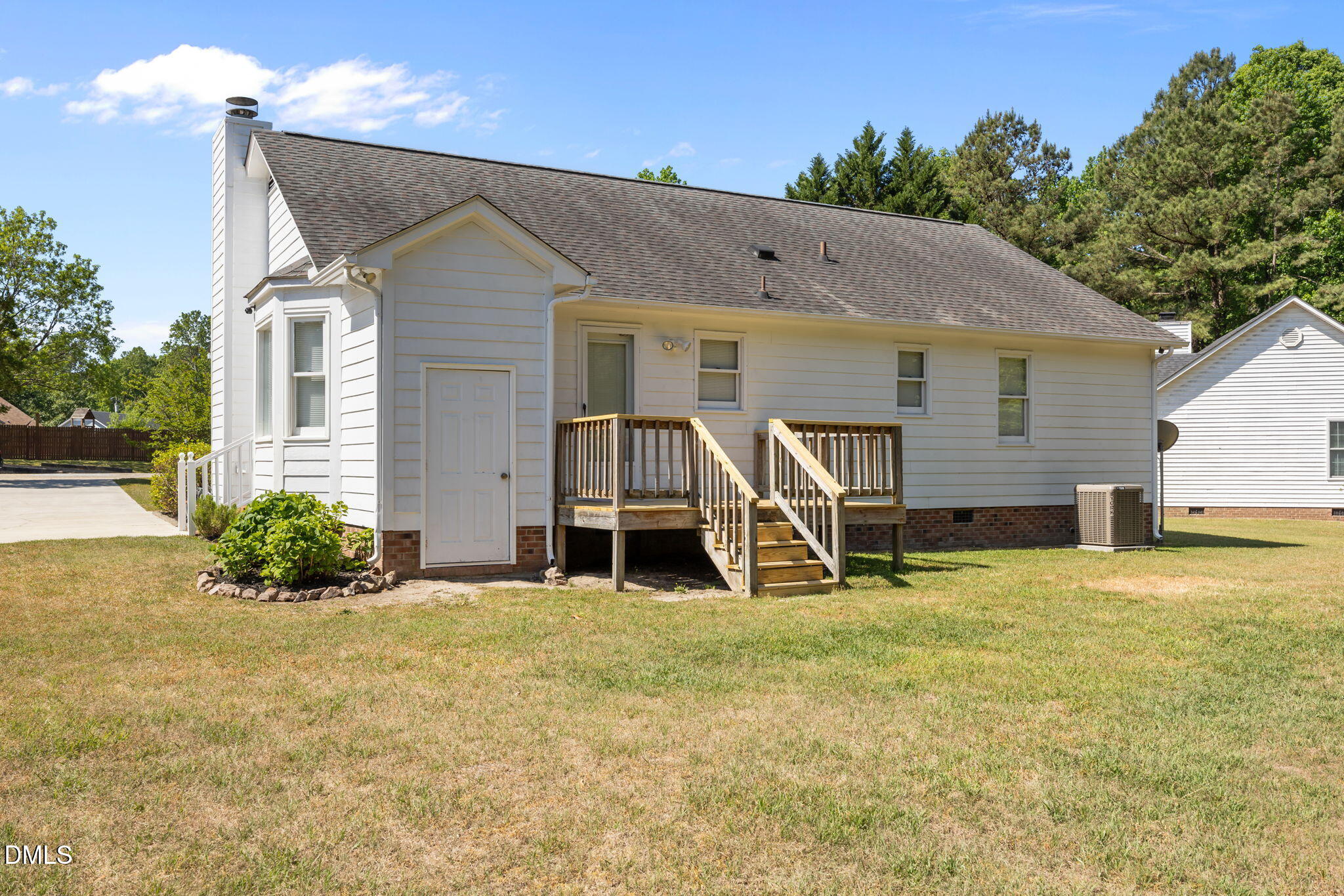 40 Circle Tree Lane Angier, NC 27501 - Photo 32 of 39 a view of a house with a yard and potted plants