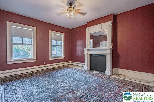 a view of a livingroom with furniture and a window